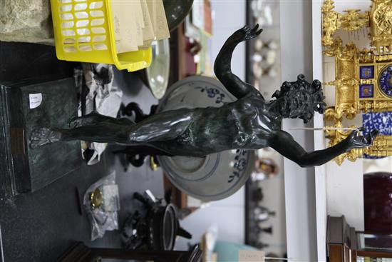 After the antique. A modern green patinated bronze model of a dancing faun, 32.5in.